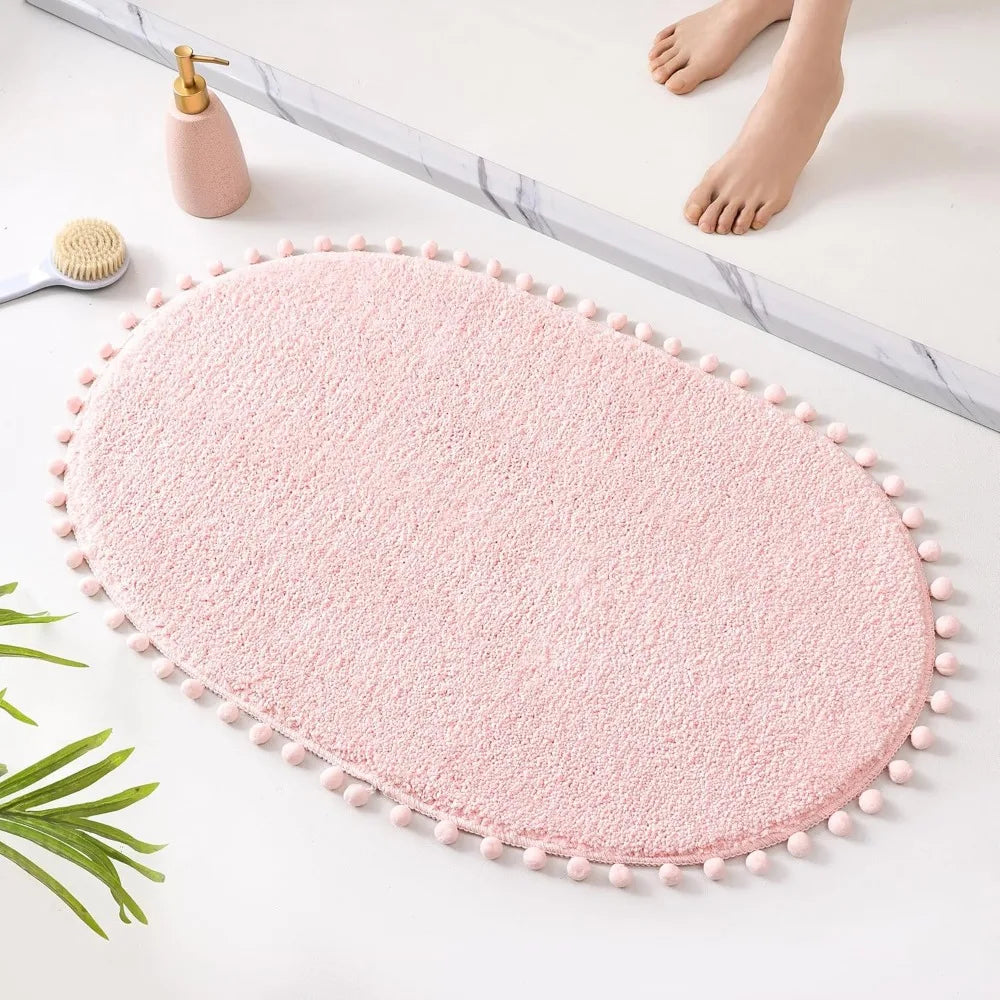 Soft Plush Cute Oval Blush Pink Bathroom Rug with Pom Poms