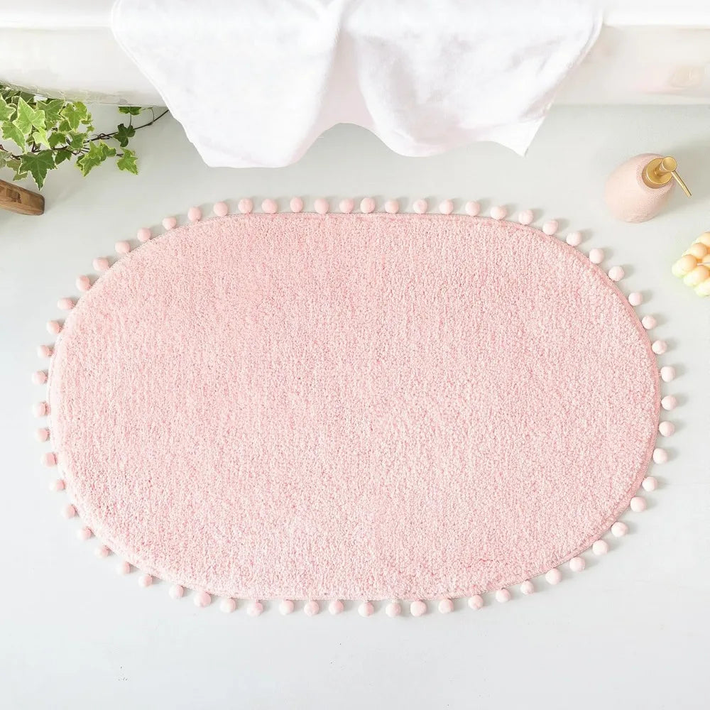 Soft Plush Cute Oval Blush Pink Bathroom Rug with Pom Poms
