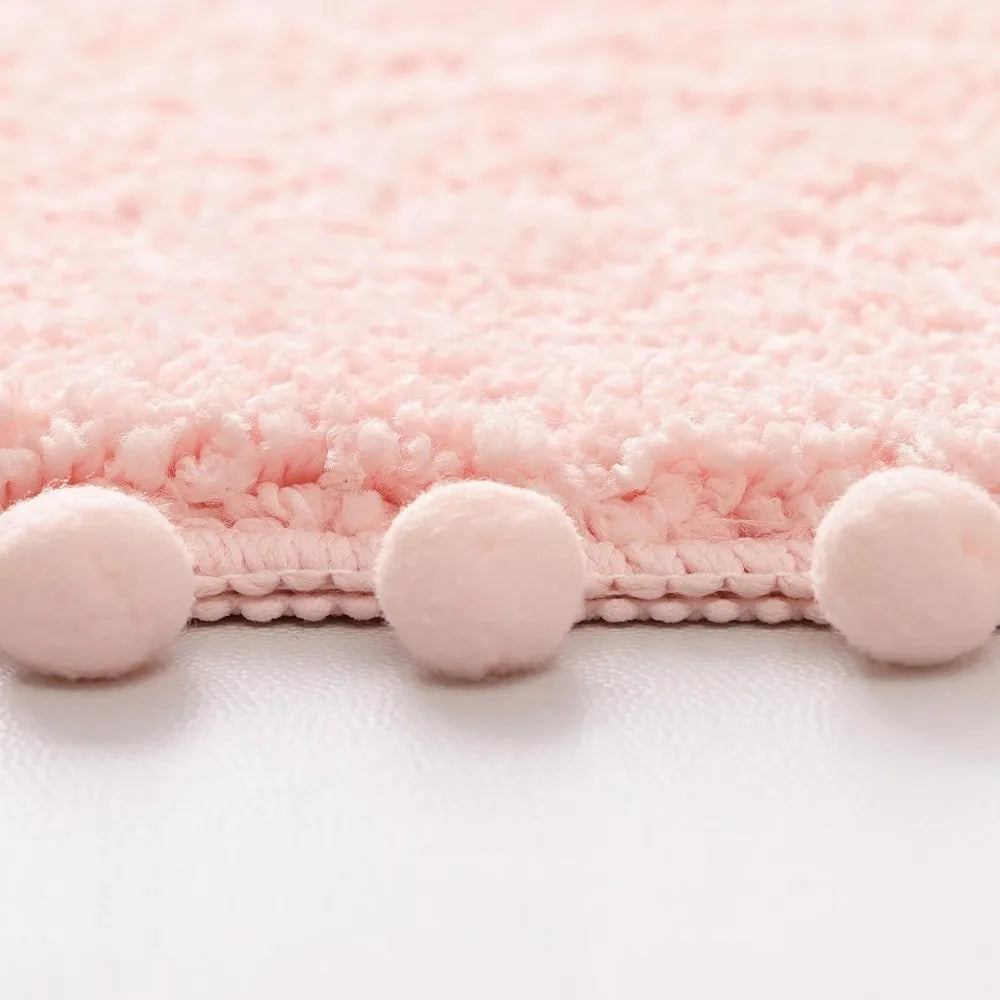 Soft Plush Cute Oval Blush Pink Bathroom Rug with Pom Poms