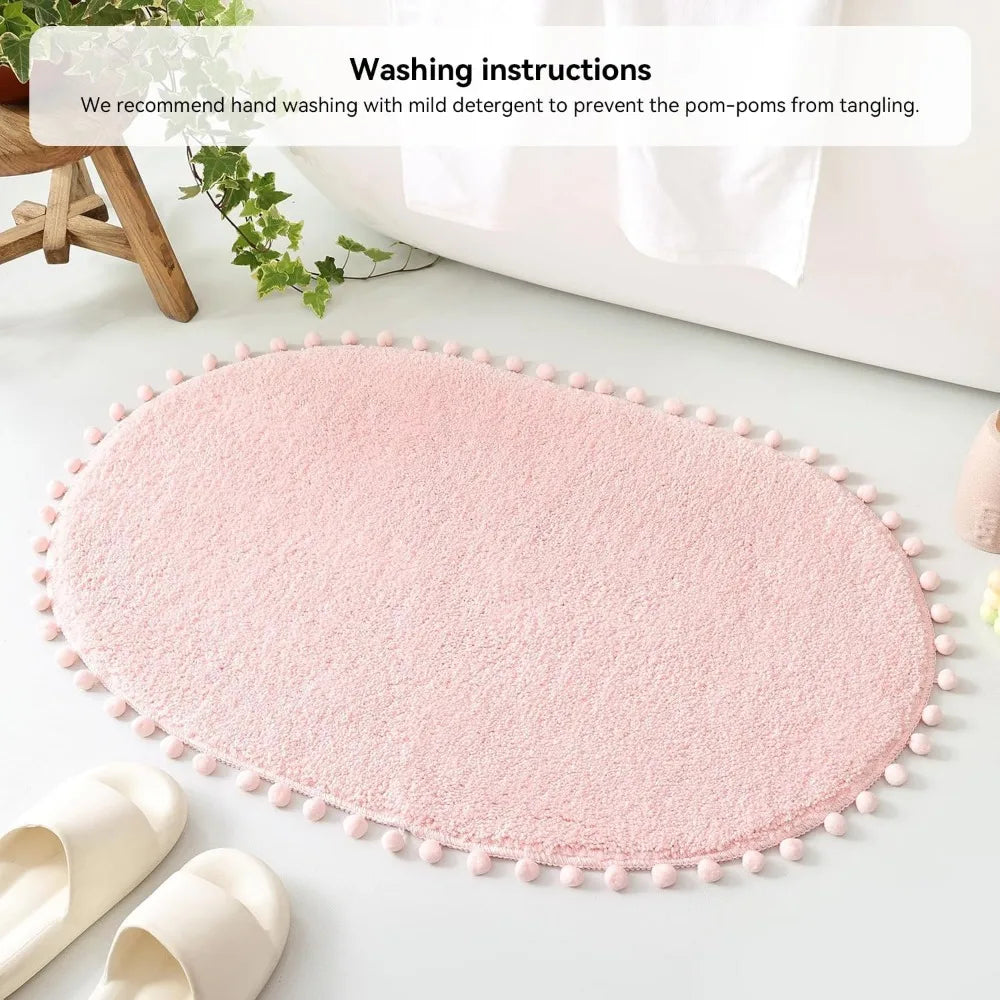 Soft Plush Cute Oval Blush Pink Bathroom Rug with Pom Poms